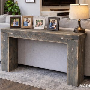 May include: A set of three ceramic mugs with a speckled, matte finish. The mugs are in shades of cream, light gray, and dark gray. Each mug has a simple, minimalist design and a rounded handle. Perfect for coffee or tea.