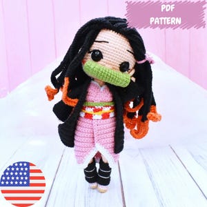 May include: A crochet amigurumi doll pattern for a character with black hair, a pink and white dress, and a green face mask. The pattern is available as a PDF download.