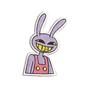 May include: Embroidered patch featuring a cartoon rabbit with a wide, yellow-toothed grin. The rabbit is purple with black eyes and wears a pink overall. The patch has a white border and is designed for application on fabric.