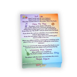 May include: A colorful game box with instructions for "Go GoGo". The box features text detailing setup, how to play, and winning the game. The box has a gradient design with orange, purple, green, and blue hues.