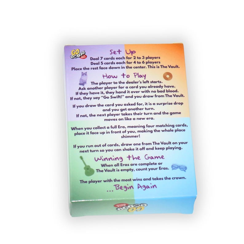 May include: A colorful game box with instructions for "Go GoGo". The box features text detailing setup, how to play, and winning the game. The box has a gradient design with orange, purple, green, and blue hues.