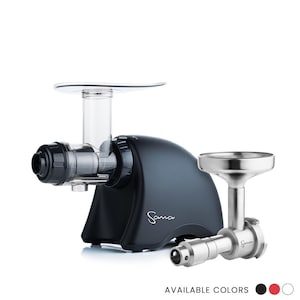 May include: A black Sana juicer with a clear plastic component and a stainless steel attachment. The juicer has the word "Sana" printed on the side. The image also shows the available colours: black, red, and white.