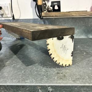 Reclaimed saw blade and wood shelf