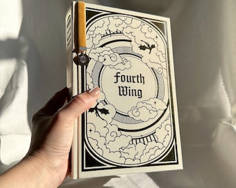 May include: A book with a white cover and black illustrations of clouds and a dragon. The title of the book is "Fourth Wing" in black lettering.