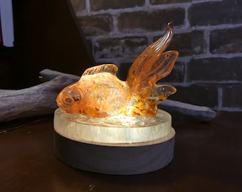 Orange-red Koi fish lamp and ocean night light with Japanese carp in handmade epoxy resin. Underwater sculpture and bedside lamp.