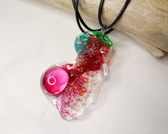 Exclusive green, pink and red resin pendant, a handmade necklace. Original jewelry with glass beads. Gift and artisan creation.