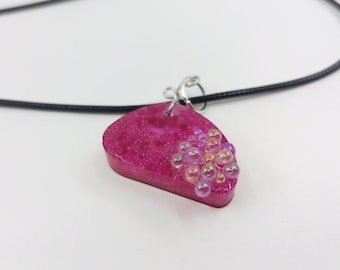 Handcrafted pendant necklace in pink resin with marbles and glass beads, an exclusive handmade piece of jewelry for her. Original gift idea.