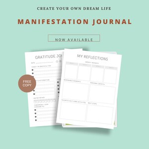 May include: A white journal with the text "Create Your Own Dream Life" and "Manifestation Journal" in brown text. The journal is open to two pages, one titled "Gratitude Journal" and the other titled "My Reflections". The journal is on a light blue background with the text "Now Available" in a white box.