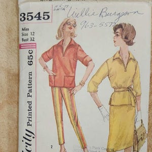 May include: A vintage Simplicity sewing pattern envelope, number 3545, size 12, bust 32. The front features illustrations of two outfits: a rust-colored shirt with striped pants, and a yellow collared shirt with a matching skirt and belt.