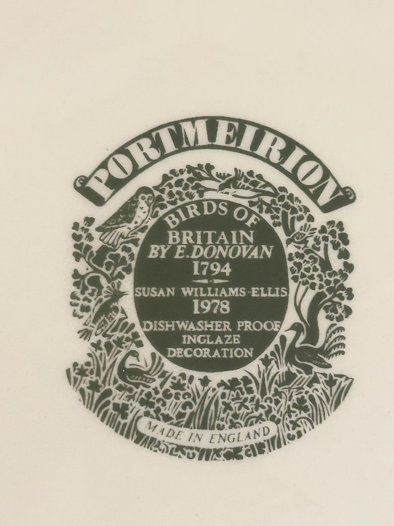 May include: A black and white Portmeirion Birds of Britain label. The label features illustrations of birds, foliage, and text including "Birds of Britain by E. Donovan 1794" and "Dishwasher Proof Inglaze Decoration". The text "Made in England" is also present.
