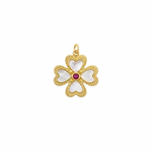 May include: A gold pendant shaped like a four-leaf clover with a textured border. Each of the four petals contains a white mother-of-pearl inlay. A small, round, deep pink gemstone is set in the center of the clover, topped with a gold bail.