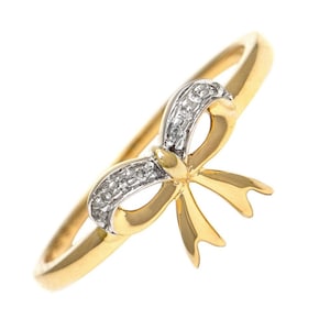 Anillo de diamantes con lazo en oro amarillo de 14 quilates