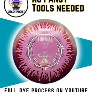 May include: A pink and purple disc golf disc featuring the text "FIREBALL" and "PLASMA". The image also includes the text "NO FANCY TOOLS NEEDED" and "FULL DYE PROCESS ON YOUTUBE OR YOUTUBE SHORTS & INSTAGRAM".