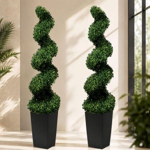 May include: Two artificial topiary plants featuring dense green foliage shaped into a spiral design. Each plant is housed in a tall, tapered, matte black square planter. The greenery consists of small, rounded leaves arranged in a continuous twist.