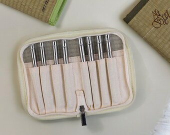 May include: A beige zippered case with 10 slots for holding silver metal tools. The case is open and the tools are visible. The case has the text "ART SECRET 890 SET" printed on the side.