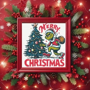 May include: A framed cross-stitch design featuring the Grinch holding a Christmas tree and the text "Merry Christmas". The frame is red and the design is on white fabric.