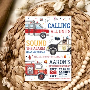 May include: A birthday invitation with a red, white, and blue theme. The invitation features a cartoon fire truck, police car, and ambulance. The text on the invitation reads "Calling All Units" and "Sound the Alarm Grab Your Gear". The invitation is for Aaron's seventh birthday party. The party is on September 26th at 2:00 PM at Aaron's House.