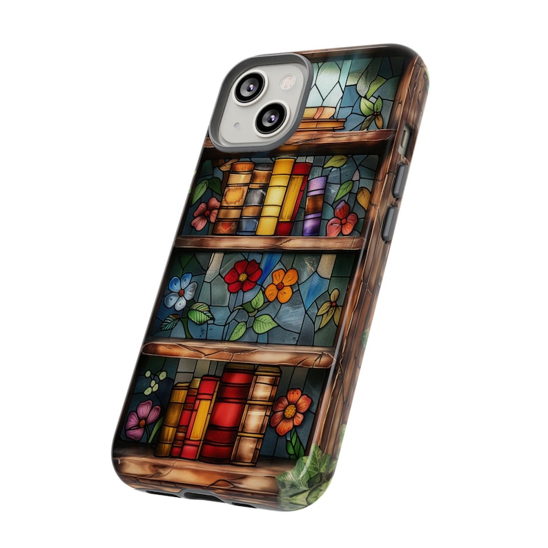 May include: A phone case featuring a stained glass design of a bookshelf with books and flowers. The case is made from hard plastic and has a clear back.
