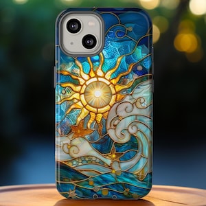 May include: A phone case with a stained glass design featuring a sun and waves. The design is in shades of blue, gold, and white.