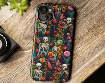 May include: A phone case with a colorful floral pattern featuring skeletons and skulls. The background is a dark green with pink, orange, yellow, and purple flowers.