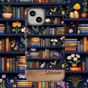 May include: A personalized phone case with a wood-grain design and the name "Sharon" engraved on the bottom. The case features a blue bookshelf background with colorful books and floral accents.