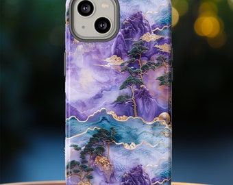 May include: Purple and blue phone case with a watercolor-style mountain and tree design. The case has a gold trim and a clear camera cutout.
