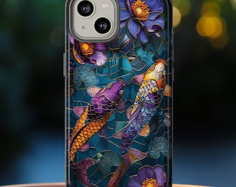 May include: A phone case featuring a stained-glass design with two koi fish in shades of purple, orange, and yellow. The case also includes purple flowers and green lily pads against a teal background.
