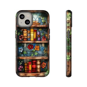 May include: A stained glass phone case featuring a bookshelf design. The bookshelf is filled with colourful books and flowers. The case is designed for an iPhone.