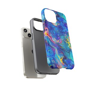 May include: A silver smartphone with a black case and a detached phone case. The phone case has a swirling blue, purple, and yellow abstract design. The phone case is designed to protect the phone.