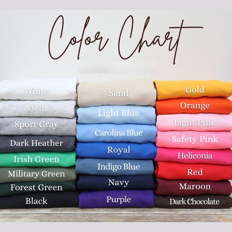 A color chart displaying various colored shirts, including white, ash, sport gray, light blue, dark gray, navy, red, maroon, and purple.