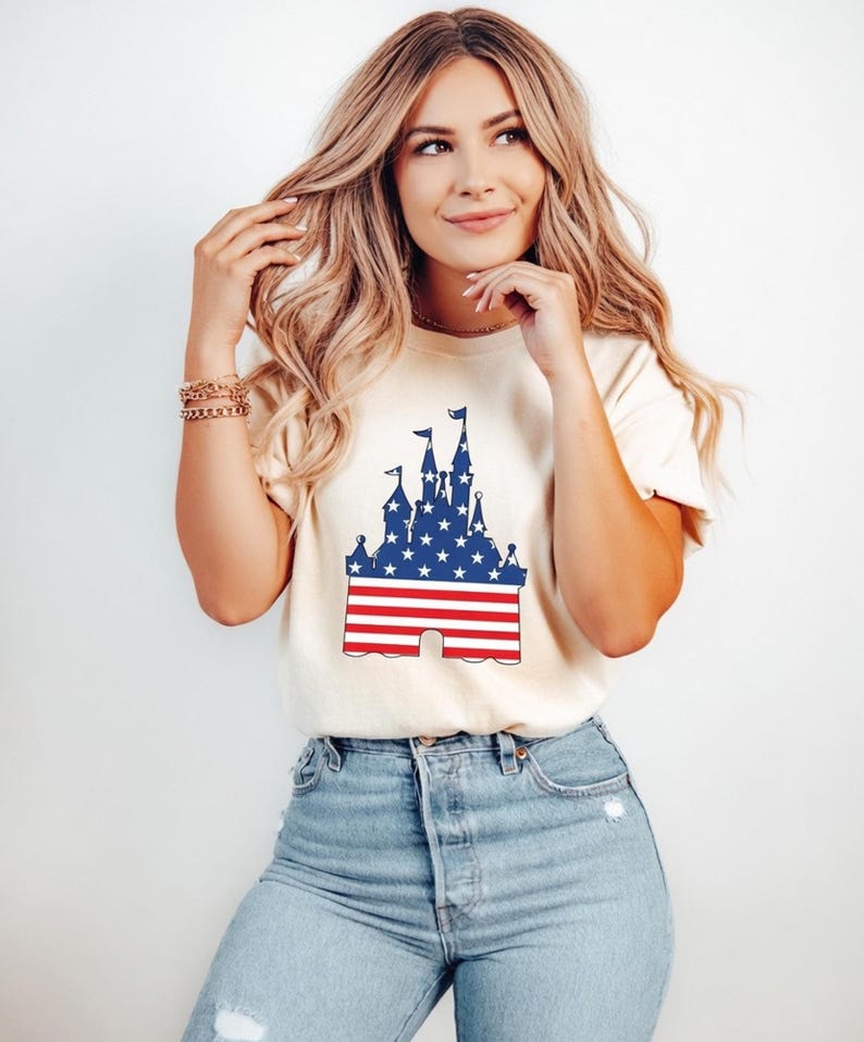 Castle silhouette with American flag design in red, white, and blue on a t-shirt.