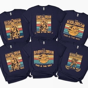 Retro-style Mandalorian-inspired designs with text "This is the Way" on navy t-shirts.