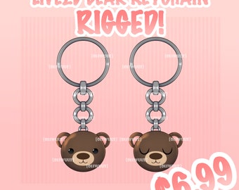 Pode incluir: Um chaveiro de urso castanho com uma corrente e um anel prateados. O urso tem os olhos fechados e um pequeno sorriso. O chaveiro é animado para Live2D. O texto "LIVE2D BEAR KEYCHAIN RIGGED!" está no canto superior esquerdo da imagem. O texto "$6.99" está no canto inferior direito da imagem.