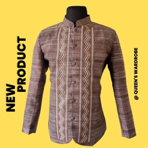 May include: A brown long-sleeved shirt with a mandarin collar and a white and brown geometric pattern. The shirt has a button closure and is made of a textured fabric.