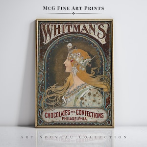 May include: A framed vintage art print featuring a woman with long blonde hair and an ornate headdress. The print advertises "WHITMAN'S CHOCOLATES AND CONFECTIONS, PHILADELPHIA" in a mosaic-style design. The words "ART NOUVEAU COLLECTION" are at the bottom.