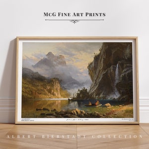 May include: A framed art print titled MCG Fine Art Prints featuring Albert Bierstadt's painting Indians Spear Fishing (1862). The landscape depicts a lake, mountains, a waterfall, and two figures in a boat. The text Albert Bierstadt is visible.