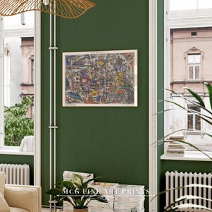 May include: A framed abstract art print with a colorful cityscape design. The print is hanging on a green wall in a room with a window and a plant.