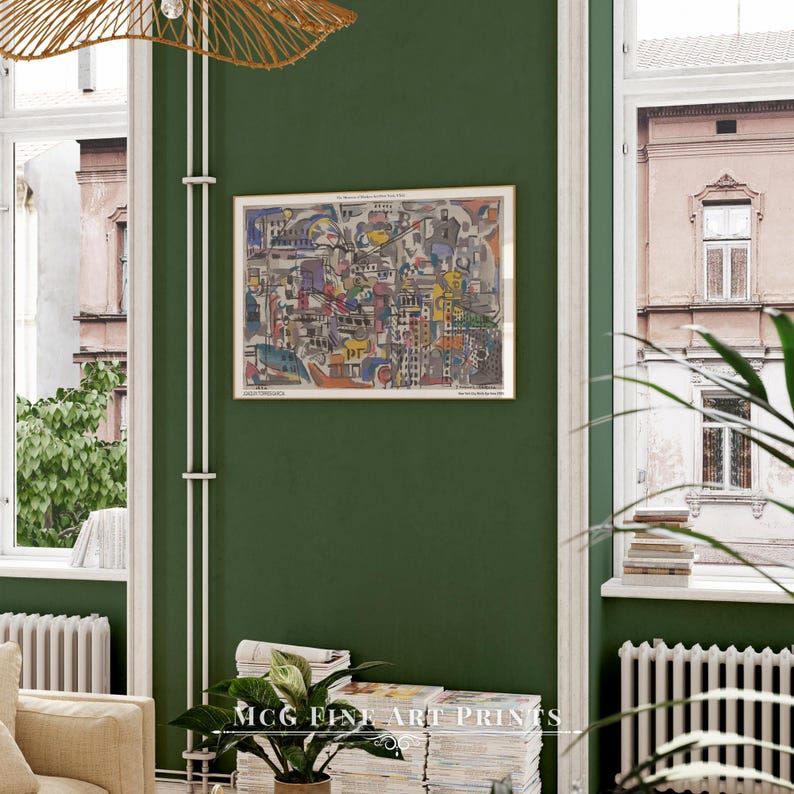 May include: A framed abstract art print with a colorful cityscape design. The print is hanging on a green wall in a room with a window and a plant.