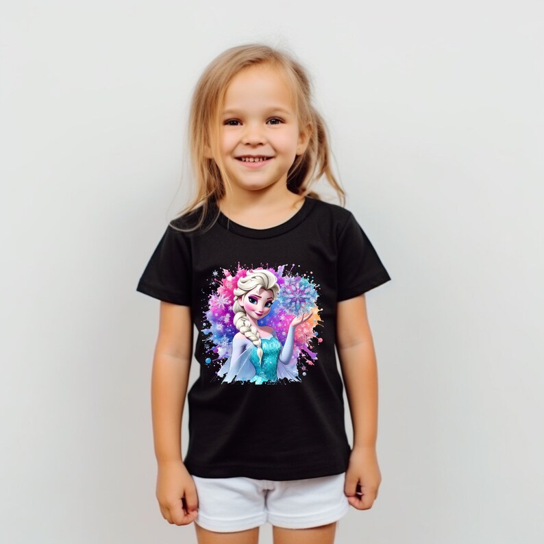 May include: Black t-shirt with a colorful graphic of Elsa from Frozen. The graphic features Elsa holding a snowflake with a blue, purple, and pink watercolor background.
