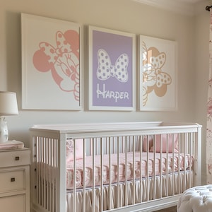 May include: A nursery with a white crib, dresser, and armchair. The crib has pink bedding and a skirt. Artwork featuring Minnie Mouse is on the wall. A tufted ottoman and floral rug complete the room's decor. A lamp sits on the dresser.