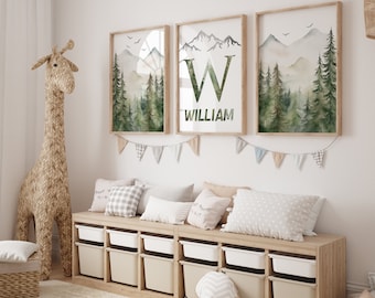 May include: Three framed watercolour prints with a mountain and forest scene. The middle print features a large letter "W" with the name "William" below it.