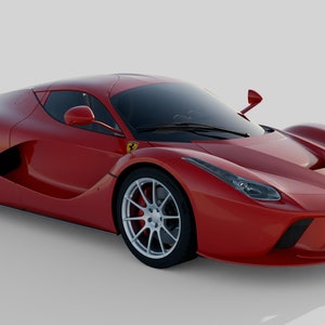 May include: A red Ferrari sports car with a black interior and silver wheels. The car is parked on a white surface.