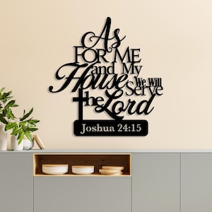 May include: Black metal wall art with the text "As for me and My Houses we will serve the Lord Joshua 24:15". The art features a cross and decorative script. The wall art is mounted on a light beige wall.