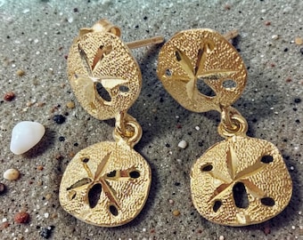 Pendientes colgantes de oro amarillo macizo de 14 quilates con forma de dólar de arena.