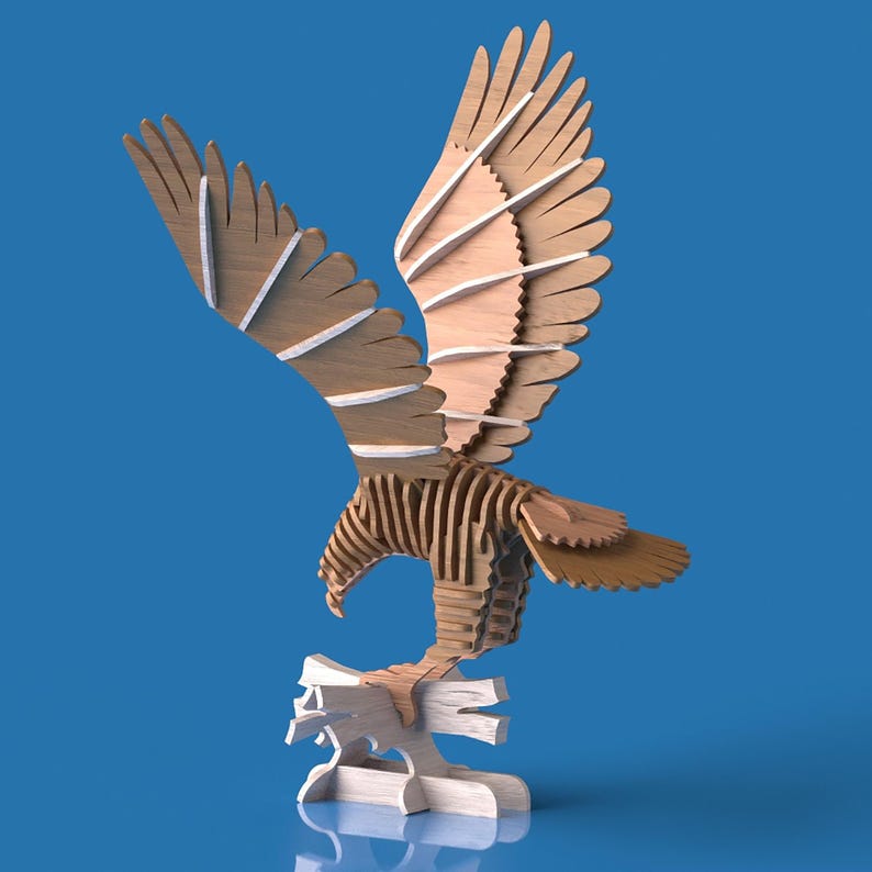 May include: A wooden eagle sculpture with outstretched wings, crafted from layered wood pieces. The eagle is perched on a stylized wooden base, with a natural wood grain finish and white accents. The background is a solid blue.