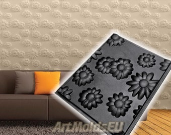 May include: Black silicone mold with multiple daisy flower shapes. The mold is on a beige background with a couch and a wooden floor.