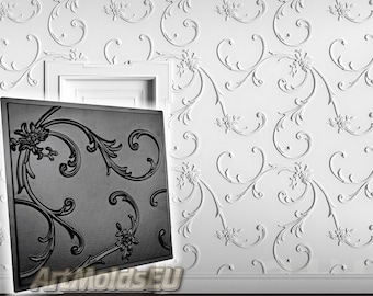May include: A black and white mold for creating a decorative wall panel. The mold features a repeating pattern of stylized flowers and leaves. The mold is shown against a white wall with a similar pattern.