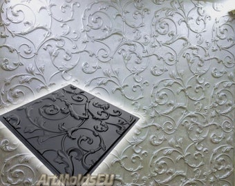 May include: A black silicone mold with a detailed floral design. The mold is used to create decorative wall panels.