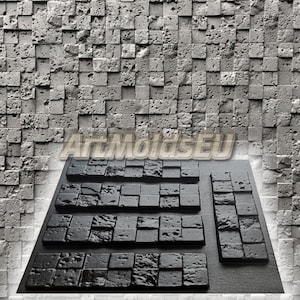 Könnte beinhalten: Ein Satz von sechs schwarzen Silikonformen zum Erstellen von Betonfliesen. Die Formen sind in einer Reihe auf einer grauen, strukturierten Oberfläche angeordnet. Die Formen sind rechteckig und haben ein Muster aus kleinen Quadraten. Der Text "ATMOIGSEU" ist im Hintergrund sichtbar.