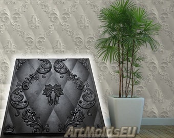May include: A black silicone mold with a decorative, ornate design. The mold is square and features a repeating pattern of floral and geometric shapes. The mold is on a white background with a similar design.